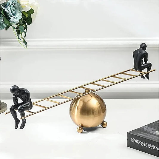 SEE SAW THINKING MAN SCULPTURE