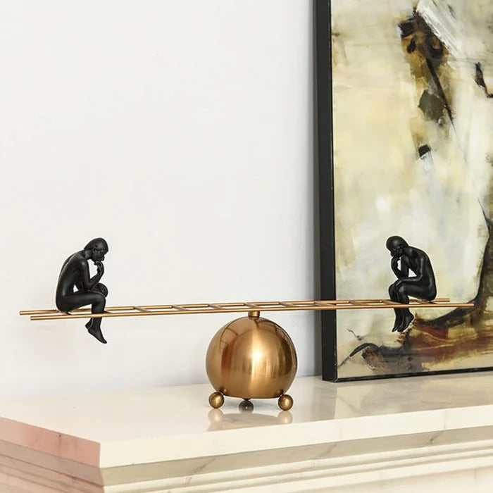 SEE SAW THINKING MAN SCULPTURE