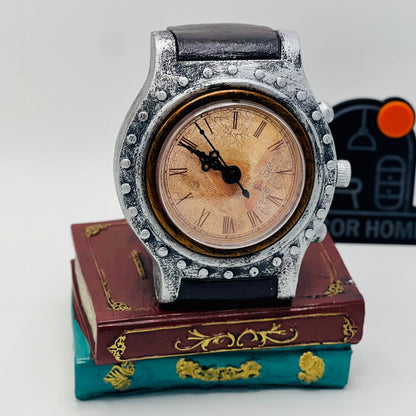 DECORATIVE WRIST WATCH ON BOOKS