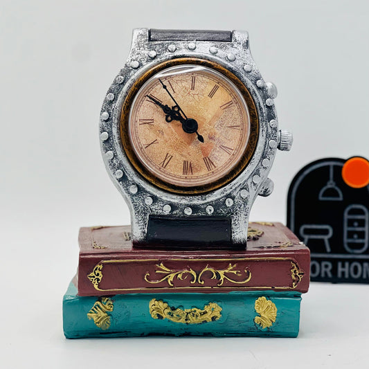 DECORATIVE WRIST WATCH ON BOOKS