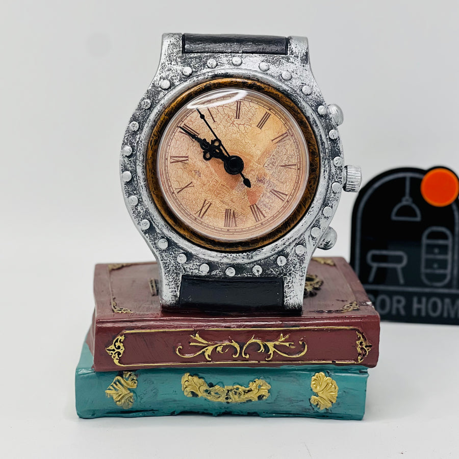 DECORATIVE WRIST WATCH ON BOOKS