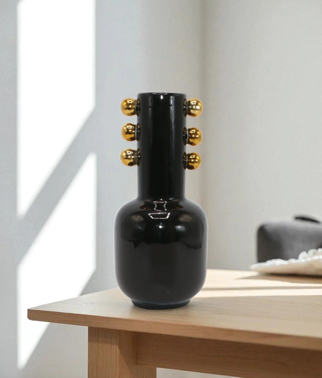 MODERN BLACK CERAMIC VASE WITH GOLD ACCENTS