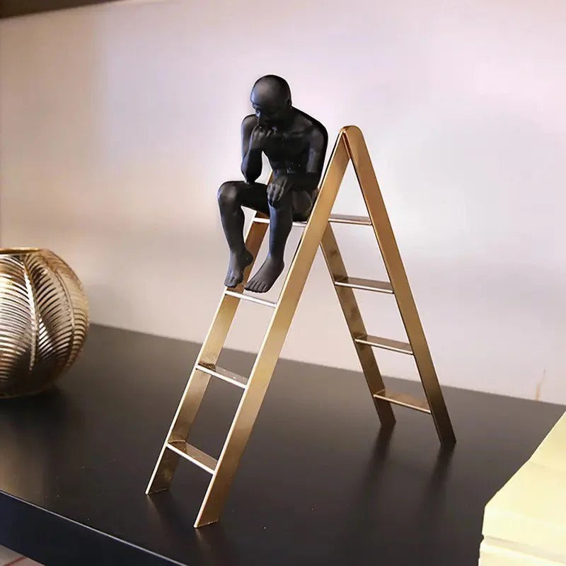THINKING MAN ON STAIRS