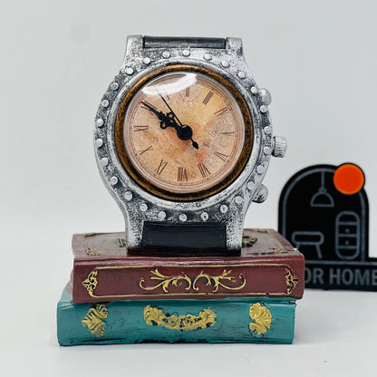 DECORATIVE WRIST WATCH ON BOOKS